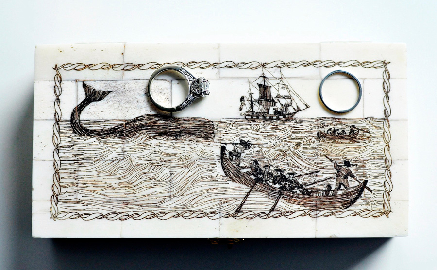 wedding rings on box with scrimshaw