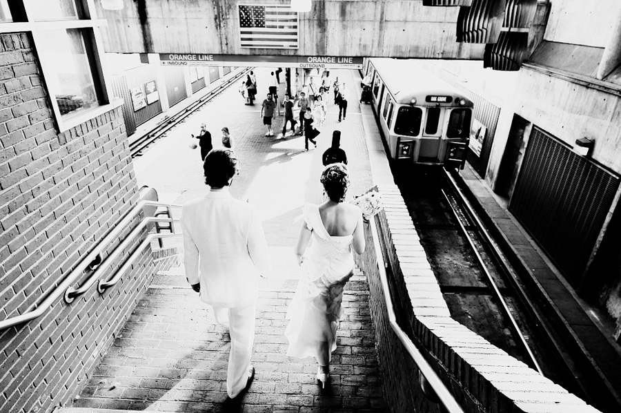 couple going on the orange line subway for their boston wedding