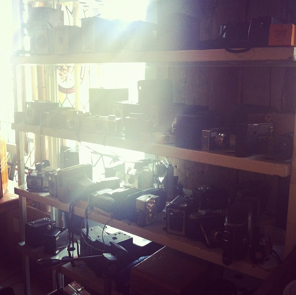 We went to this amazing store -- Architectural Salvage -- and I found a whole shelf full of old cameras. Drool.