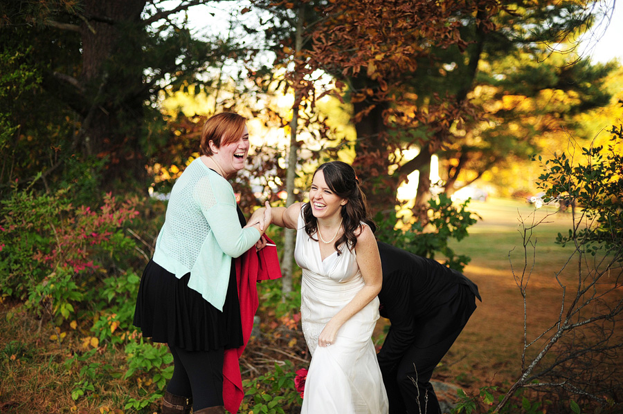 One of Tina's many assisting jobs -- helping brides through tough terrain. :)