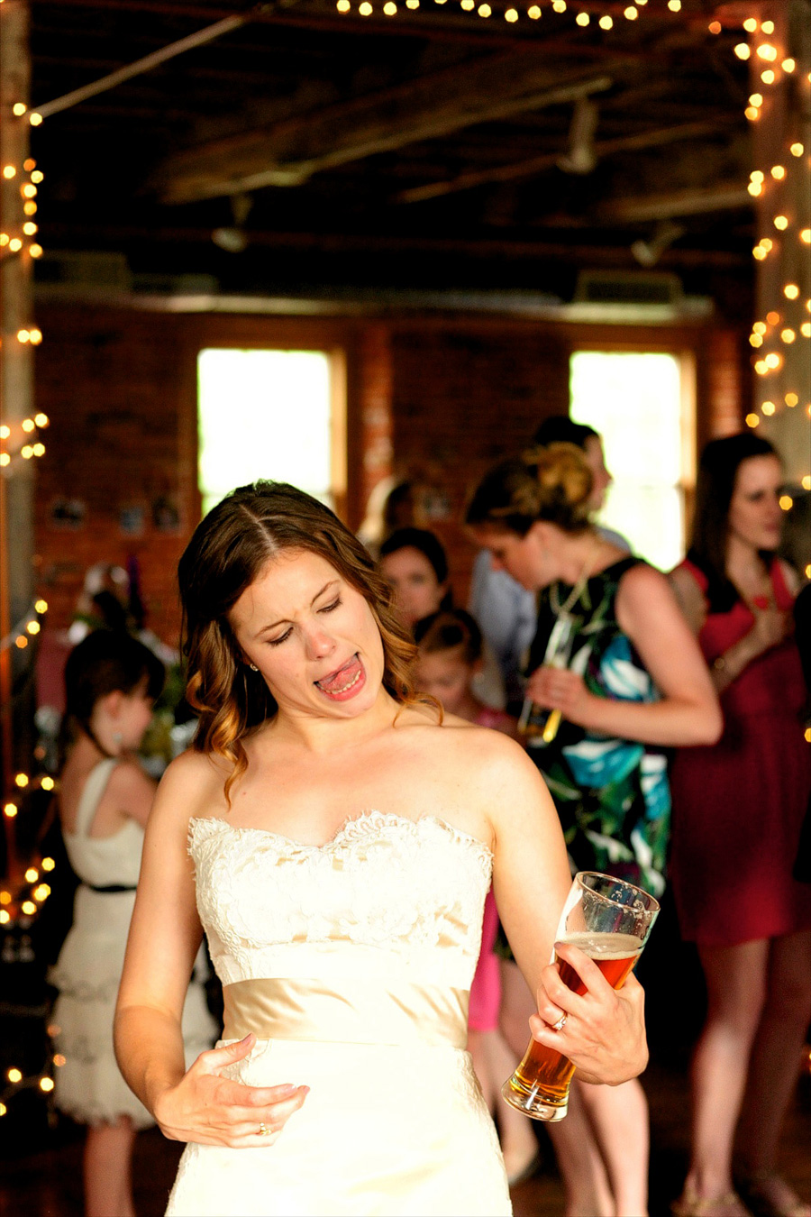 You know it's good when the bride is playing air guitar. :)