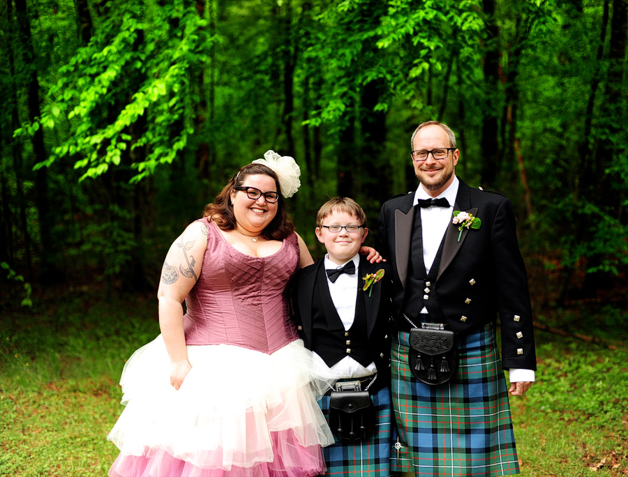 I adore this shot of Jamie & Jon with Jon's son -- in matching kilts!