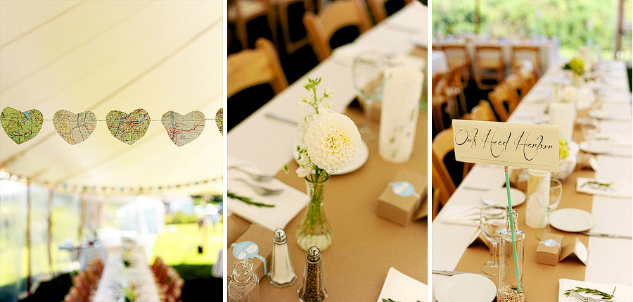 Map hearts strung throughout the reception tent, a gorgeous array of flowers, and tables named after various spots they love.