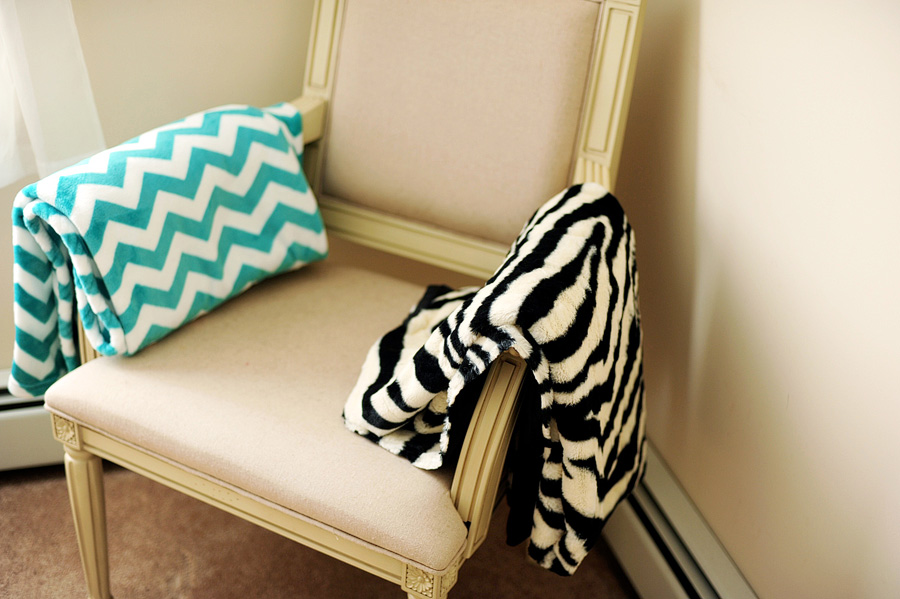 A gorgeous chair, and a couple of options for blankets -- teal chevron & zebra print!