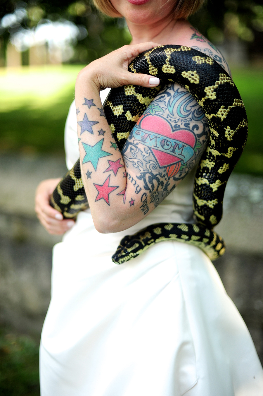 offbeat bridal session with a tattooed bride and a snake