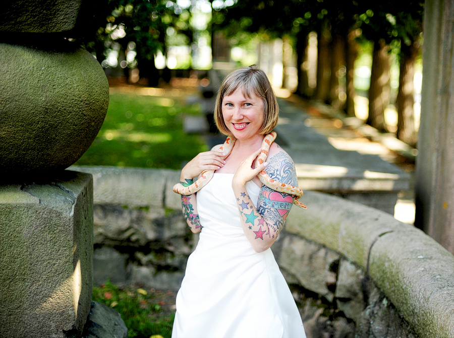 tattooed bride holding a snake