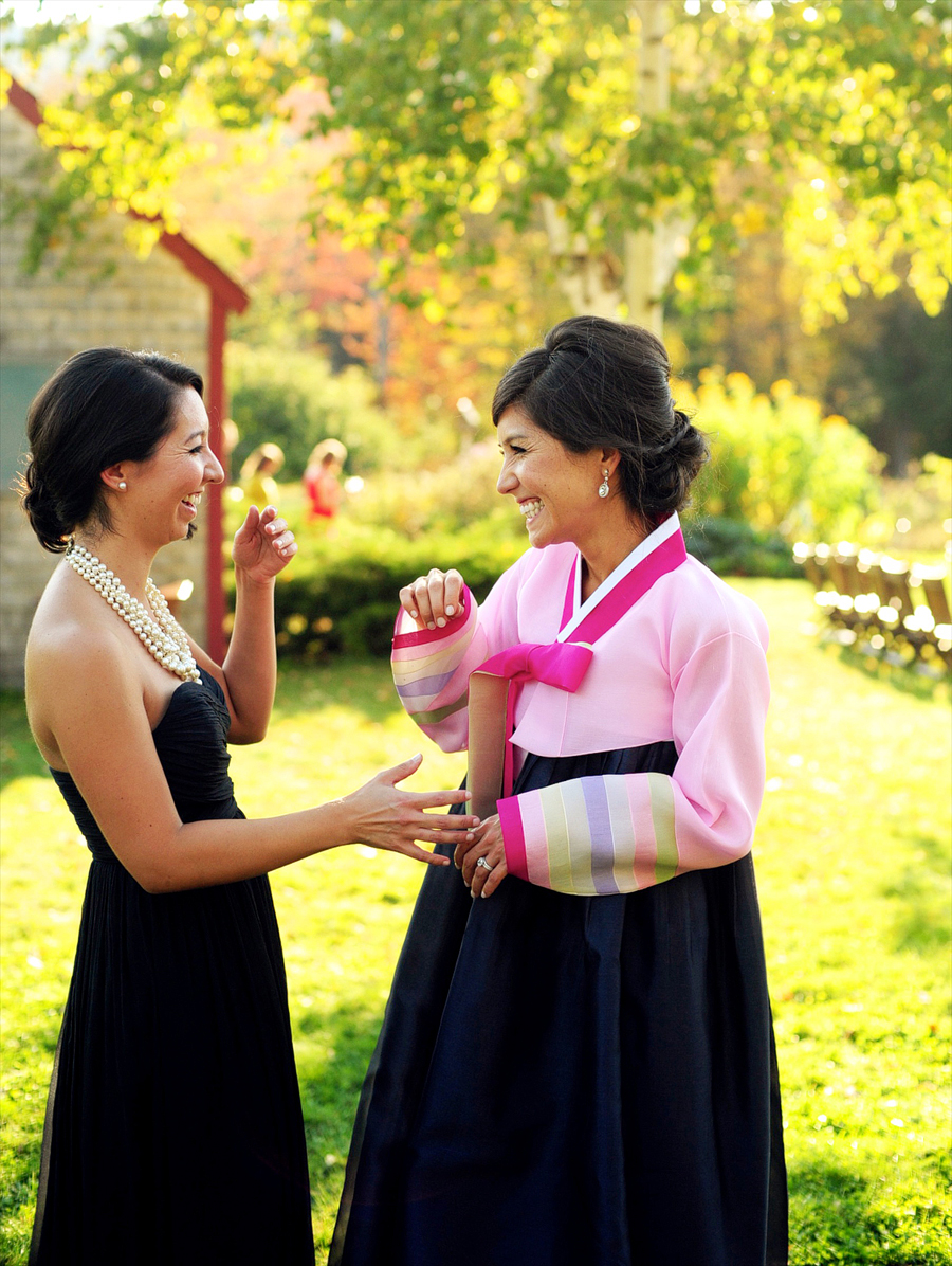 bride laughing with her sister