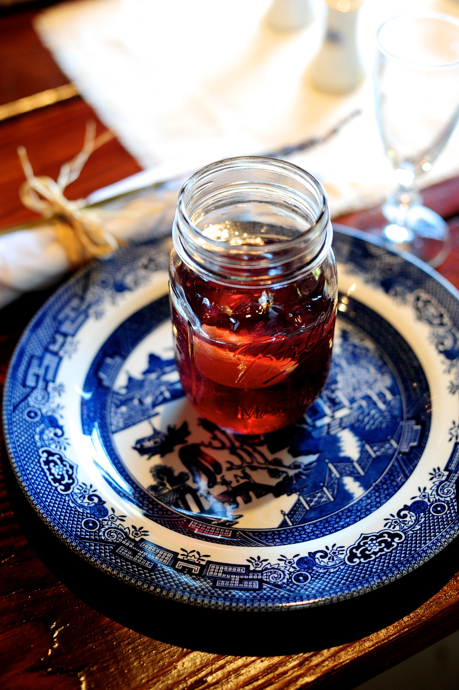 mason jars and mismatched vintage plates at wedding