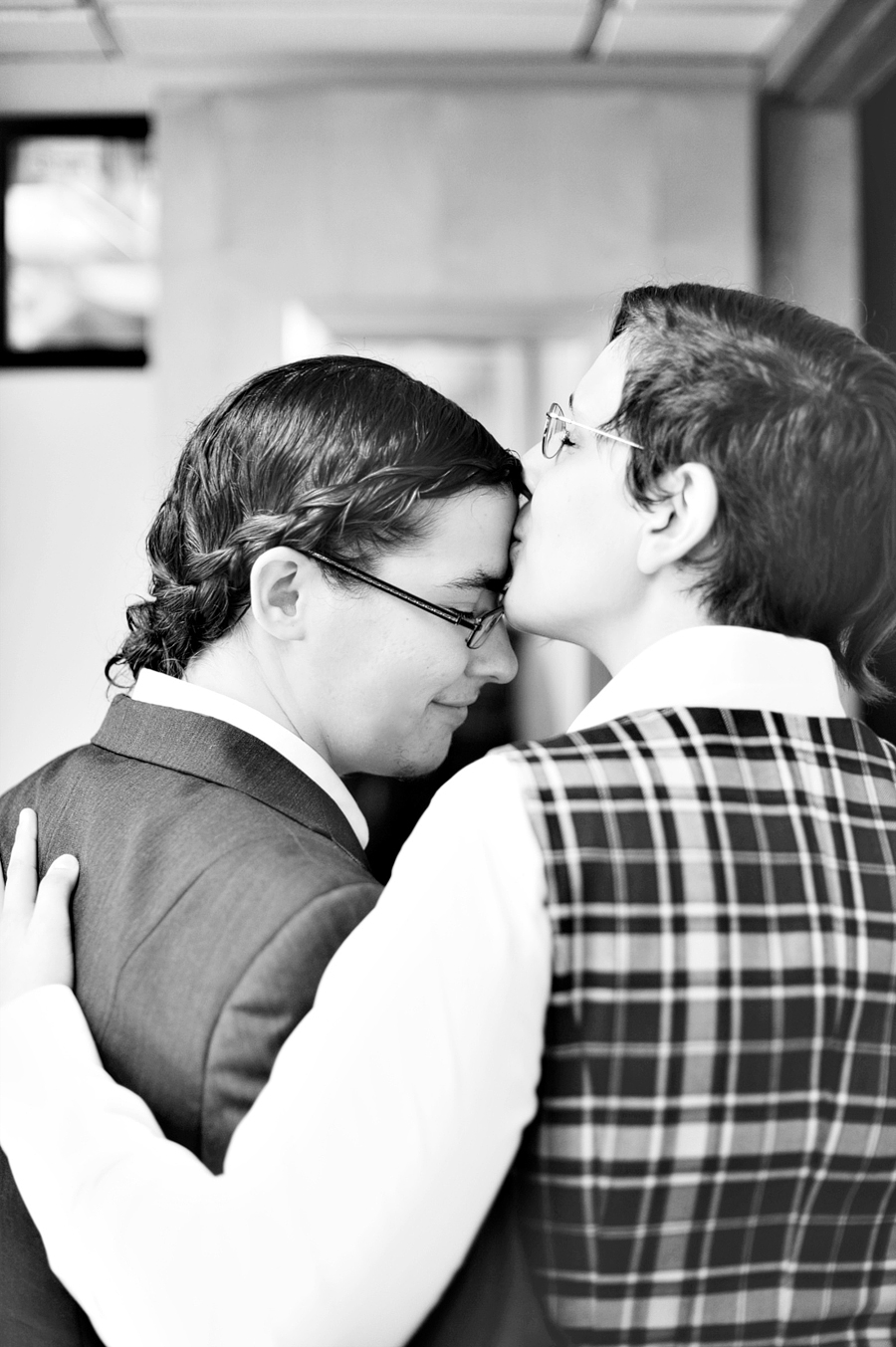 couple getting ready together before their wedding