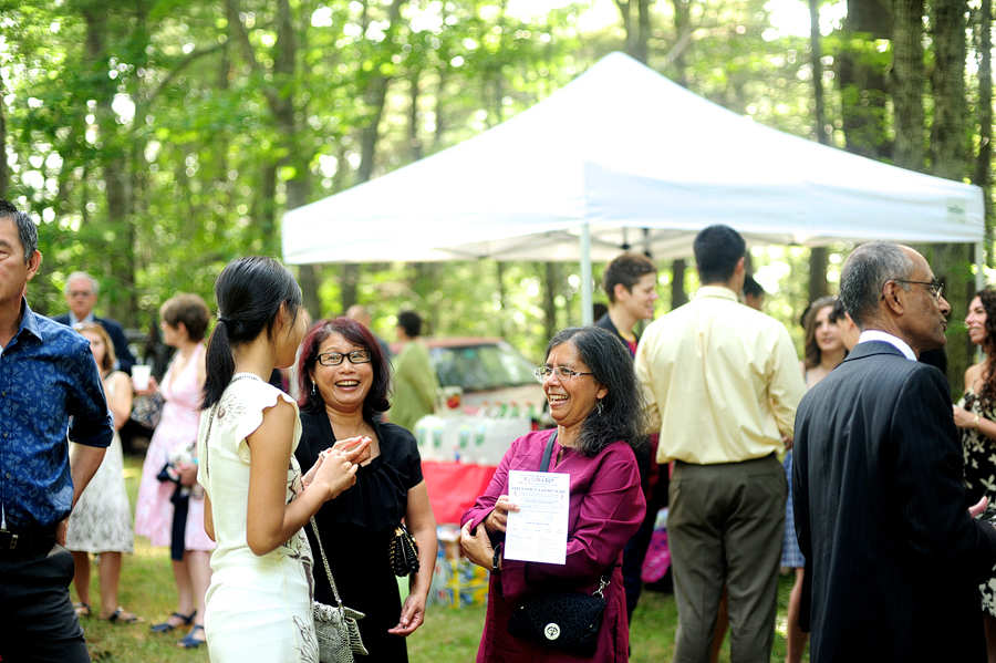 family mingling outdoors at a wedding