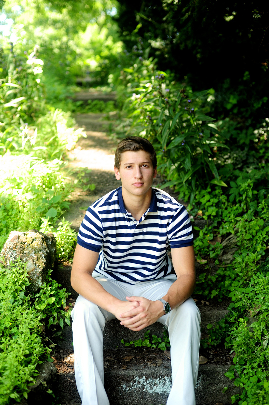 senior photos in a striped polo shirt