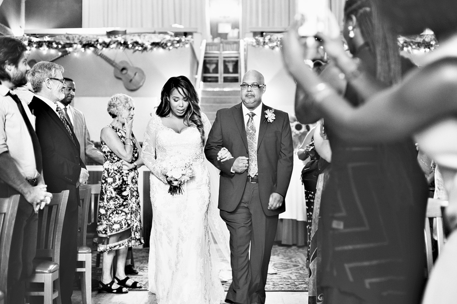 dad walking bride down the aisle at the stone mountain arts center