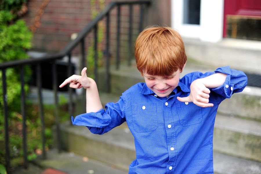 kid dancing during family photos