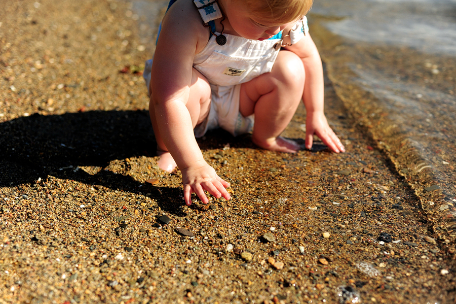 baby playing in the sand at castle island