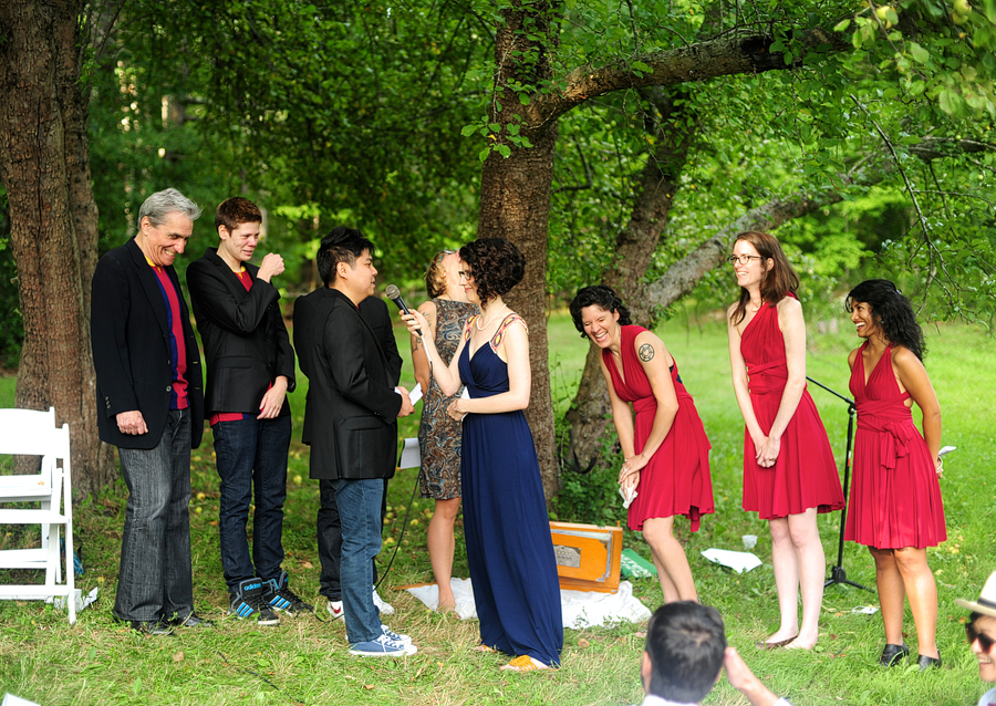 candid photo of a casual outdoor wedding ceremony in maine