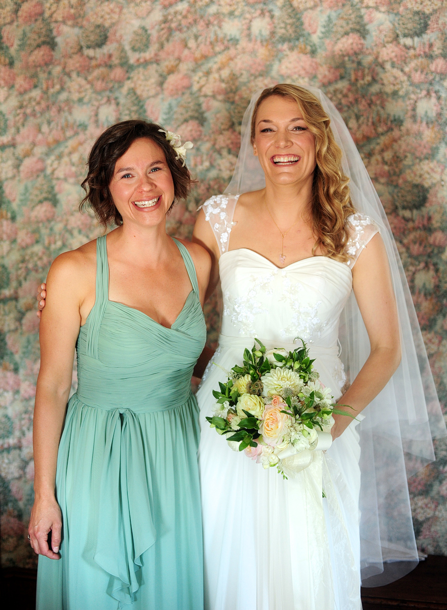 happy, natural portrait of bride with her maid of honor