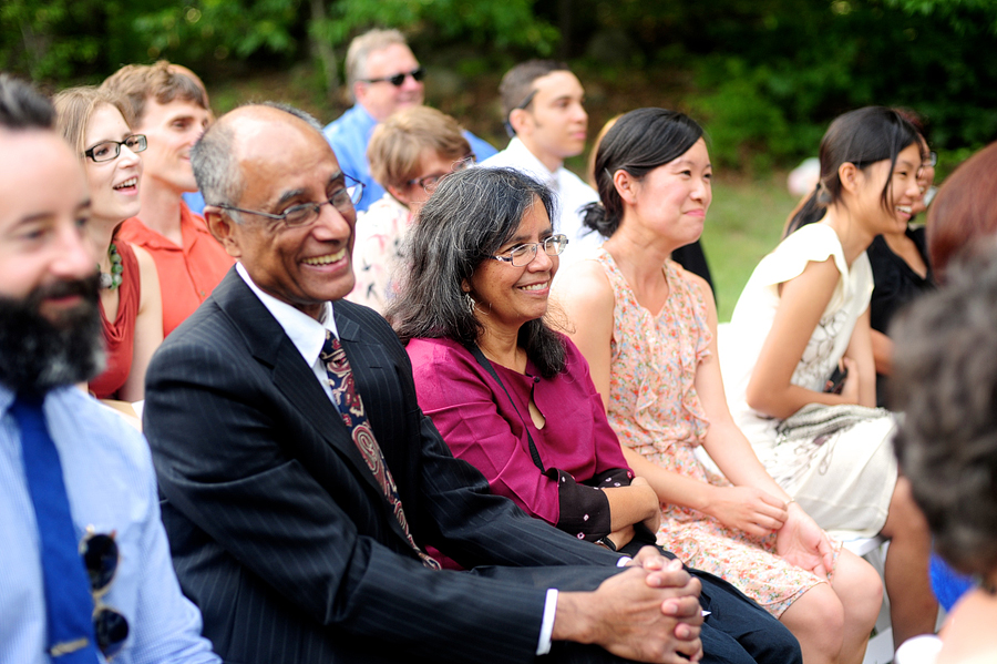 guests laughing during a wedding ceremony