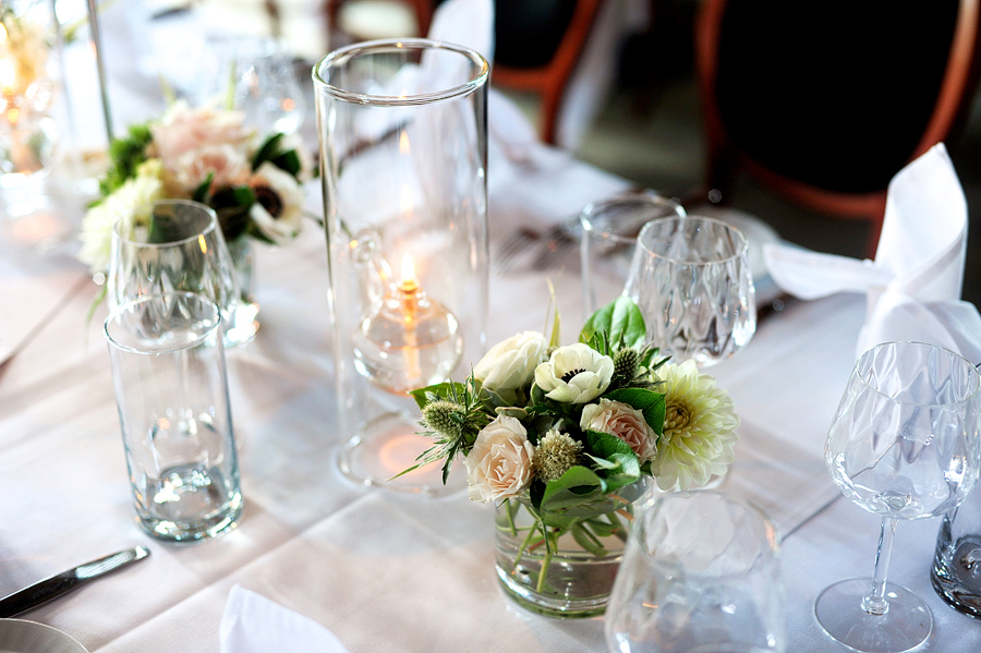 hurricane vase centerpiece at on the marsh bistro wedding