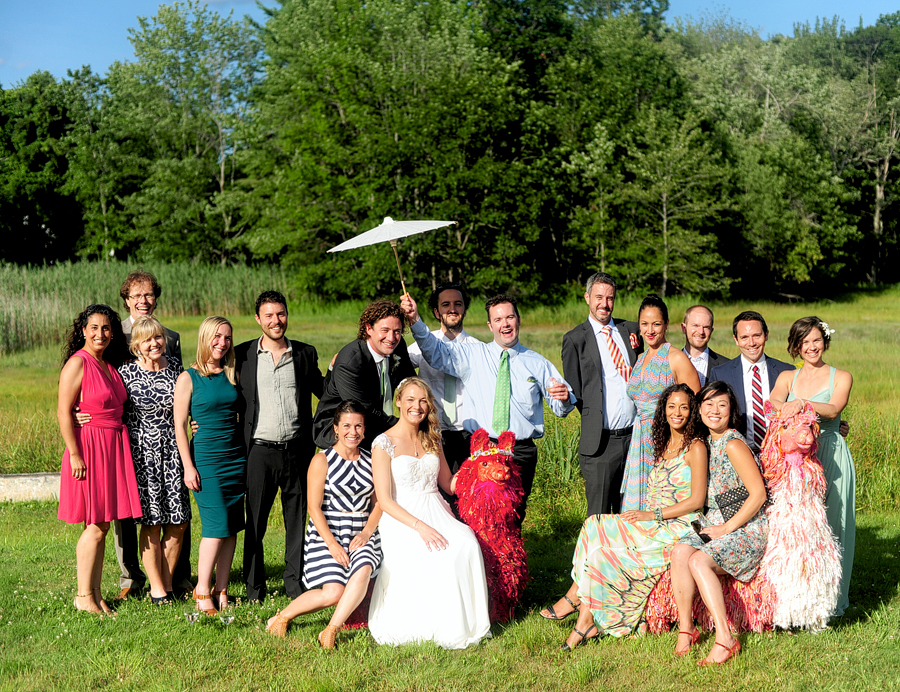fun wedding guest photo with paper parasol