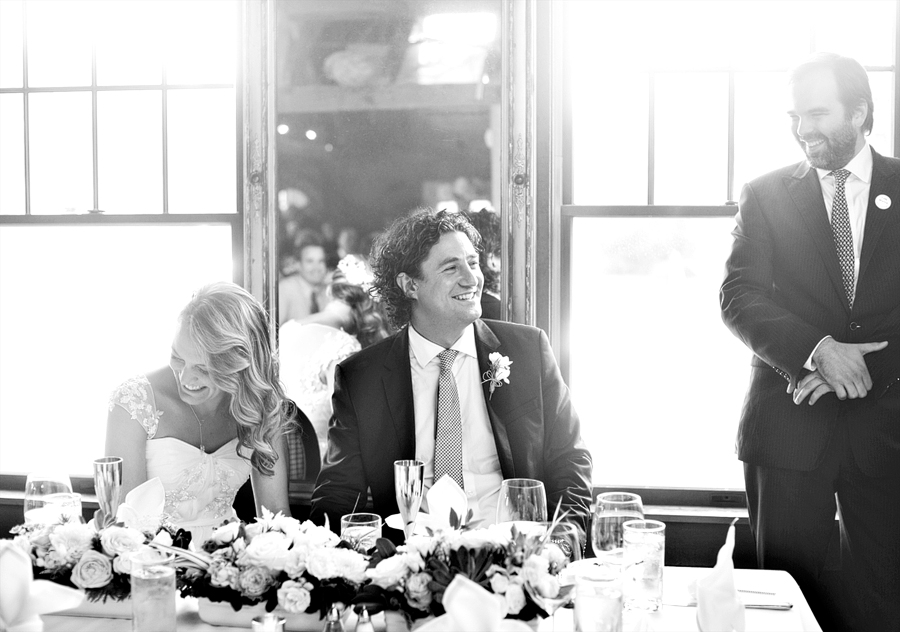 couple laughing at a wedding toast in kennebunkport, maine