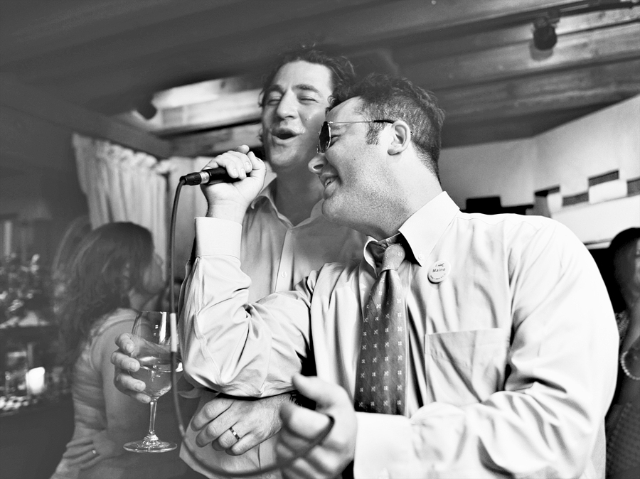 candid singing photo at on the marsh bistro wedding