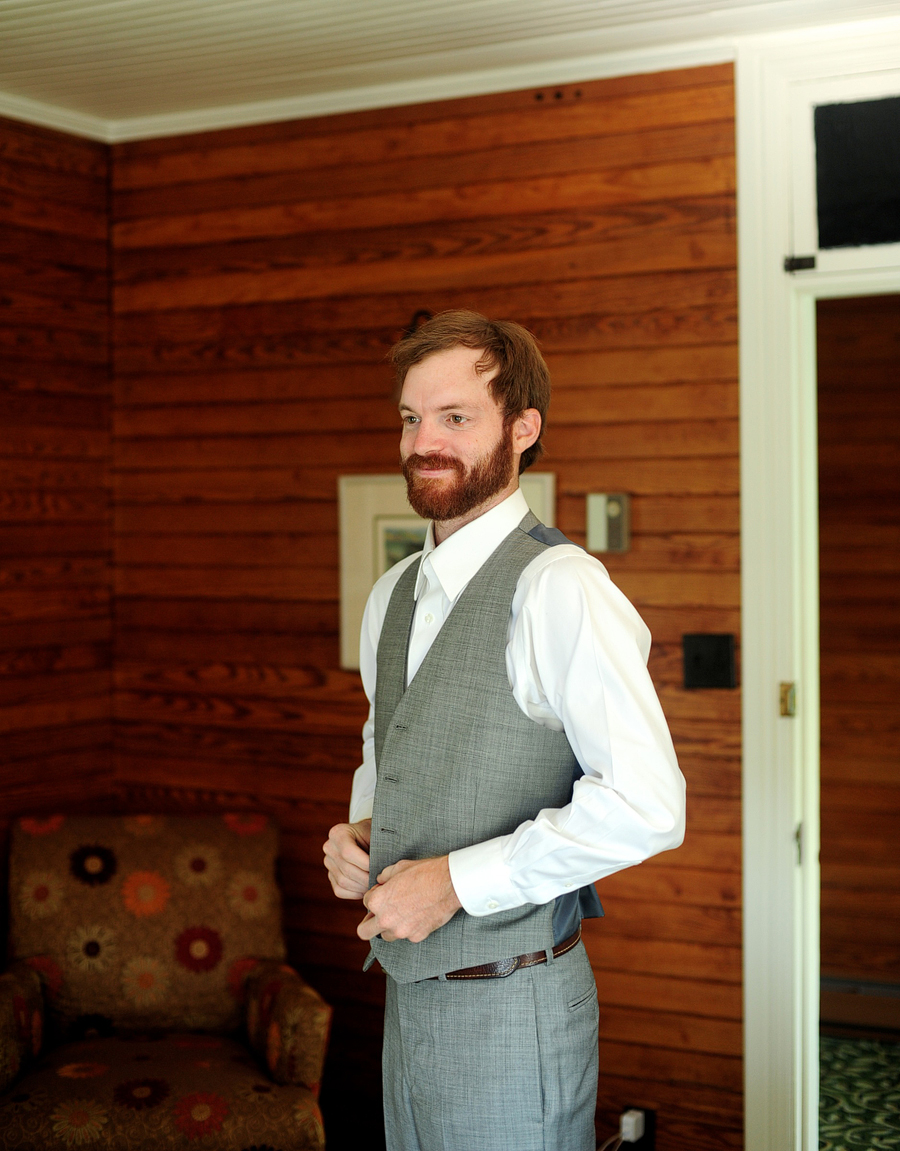 groom in a grey suit and vest