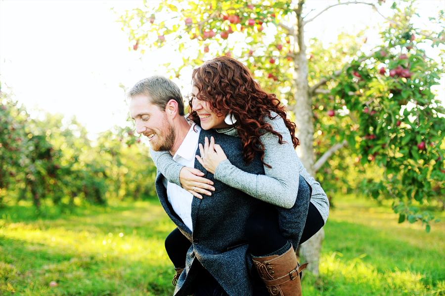 fun, candid engagement photos at an apple orchard in maine