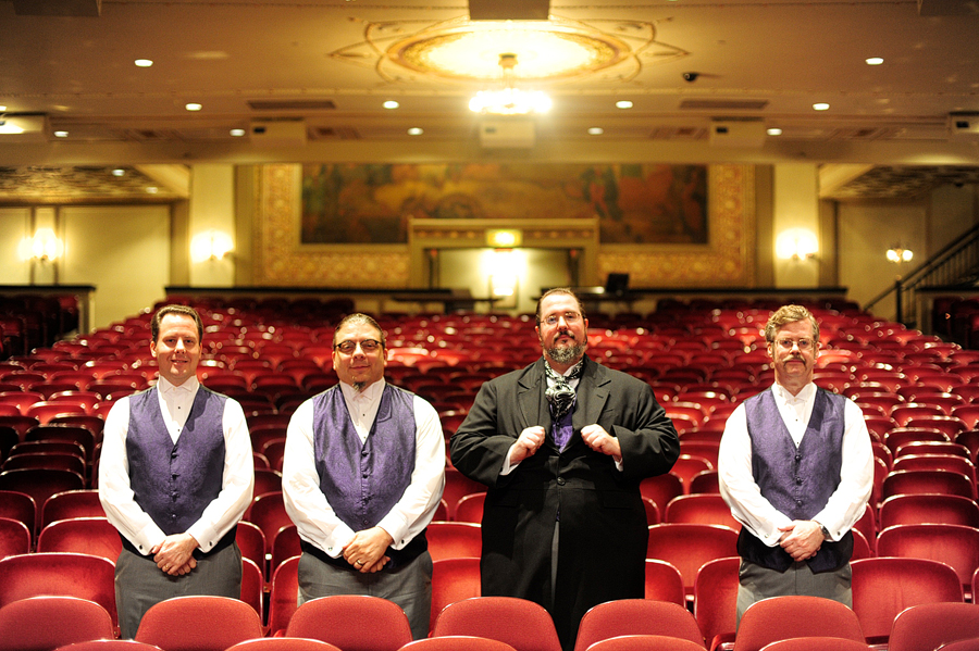 groomsmen posing in santander performing arts center theater