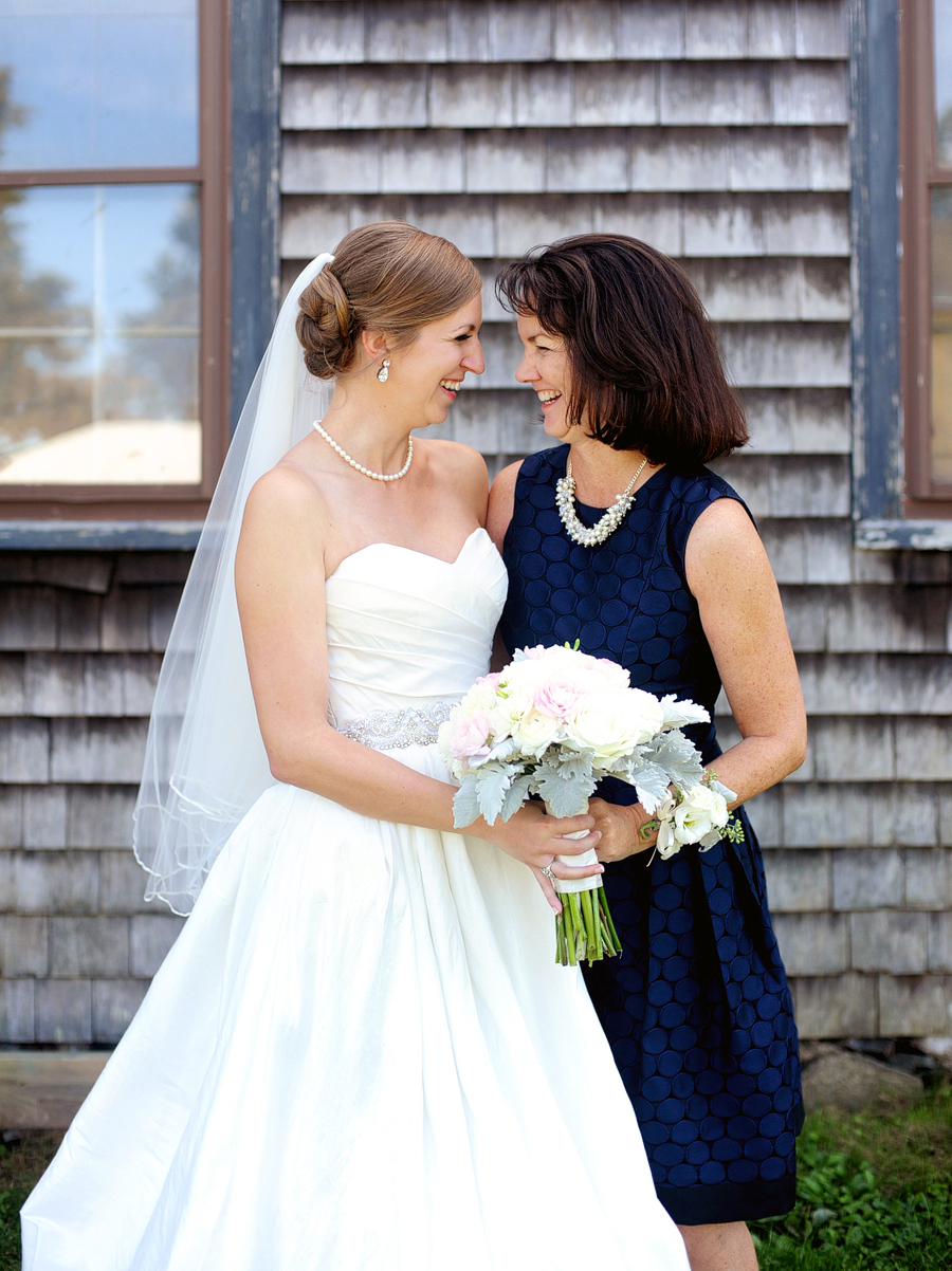 bride laughing with her mom