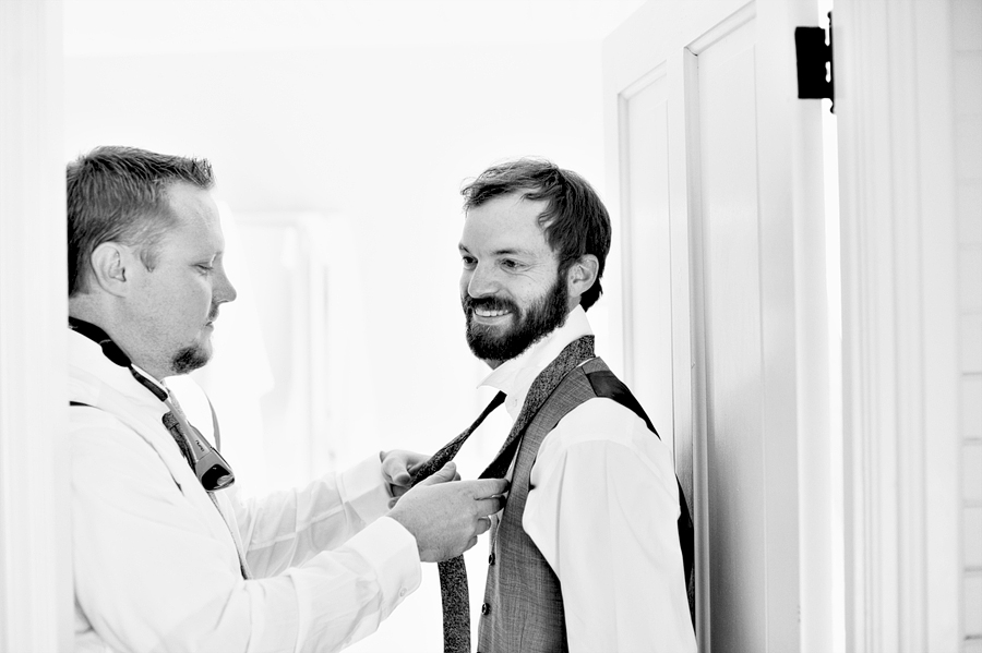 groom laughing with his groomsmen