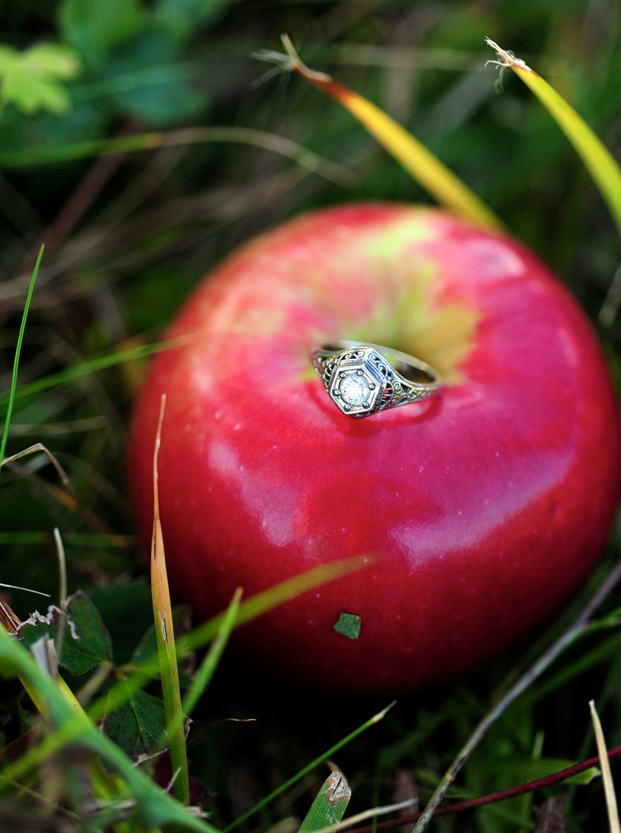 engagement ring on an apple