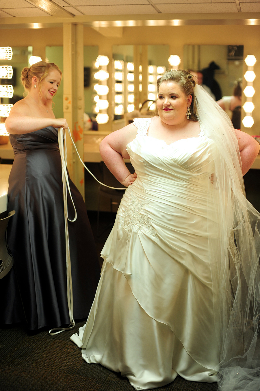 bride getting ready in theater dressing room at santander performing arts center