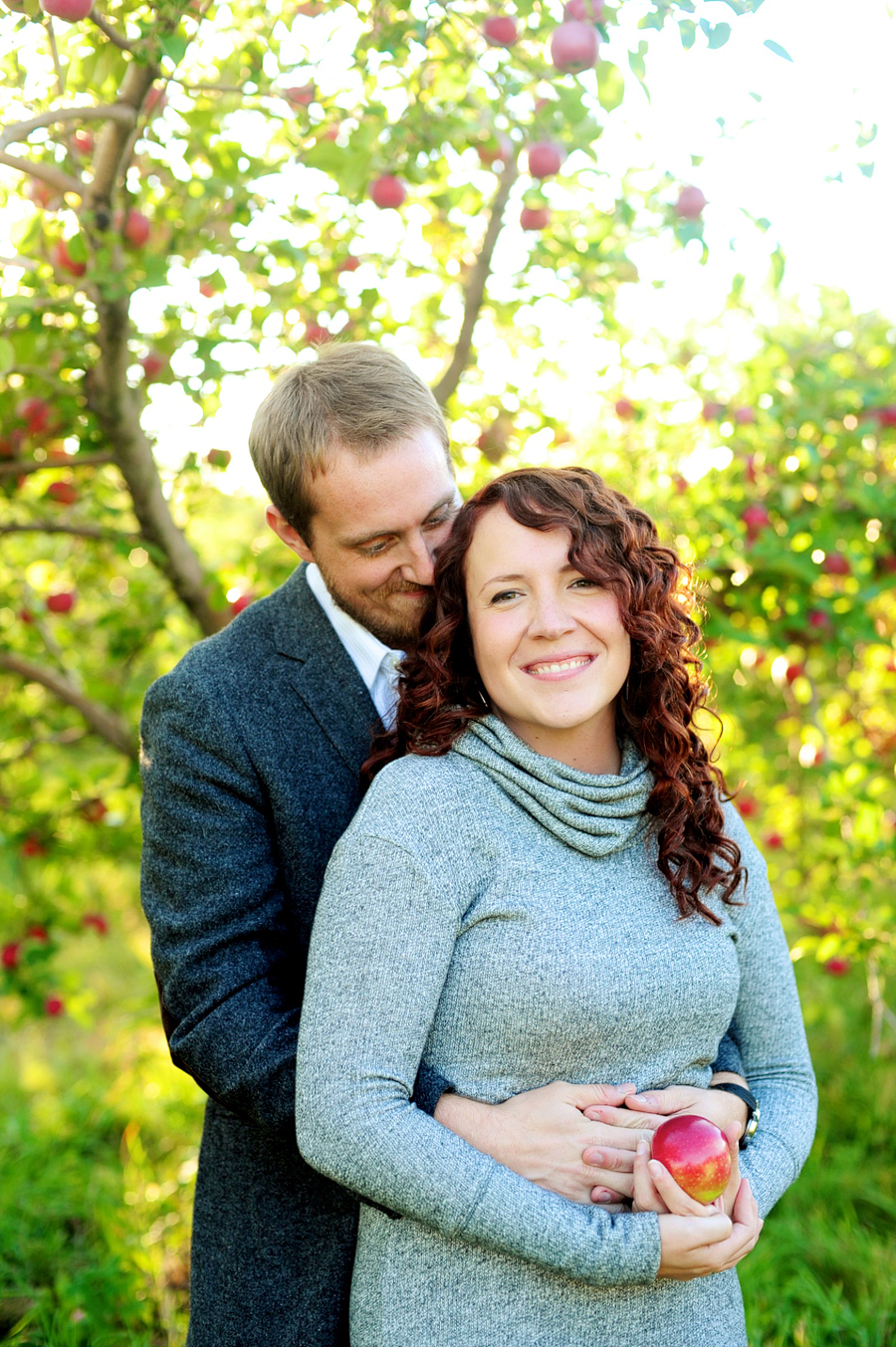 silly, fun engagement photos in an apple orchard