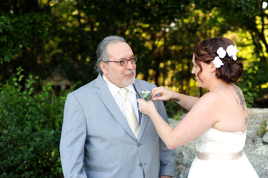 bride helping her dad with his boutonniere