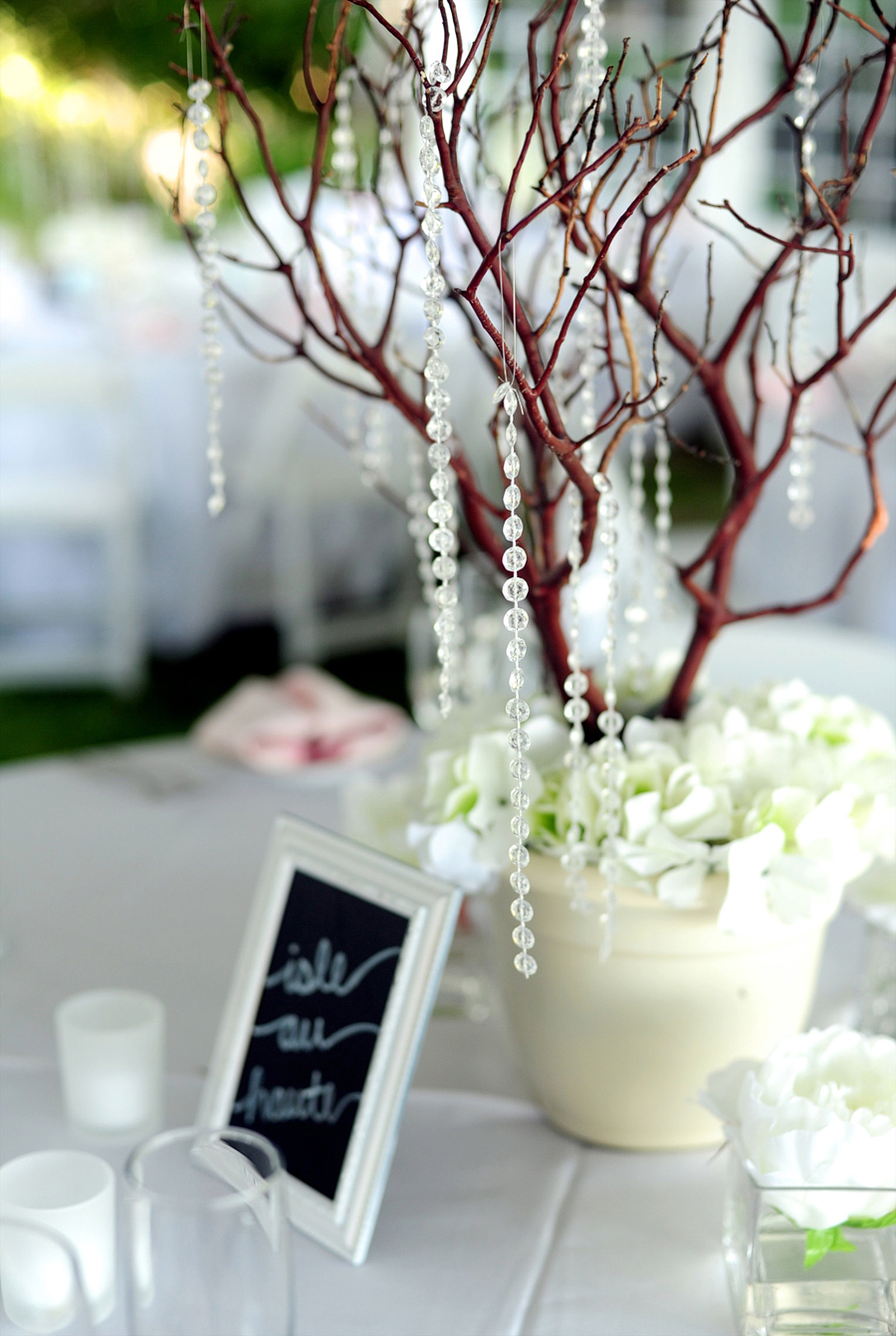 wedding centerpieces with trees and hanging crystals