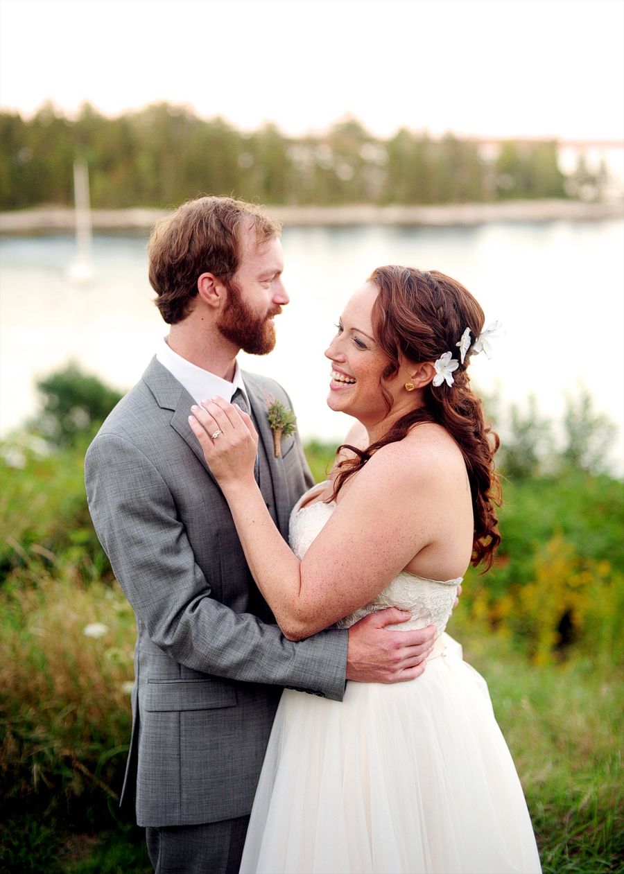 couple laughing together at grey havens inn in georgetown, maine