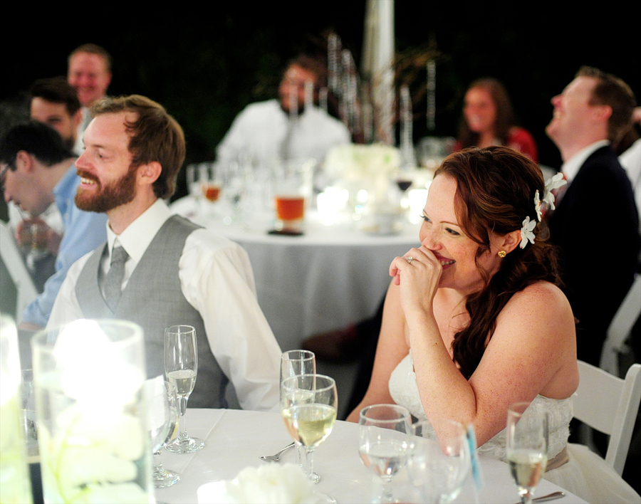 couple listening to their wedding toasts in maine