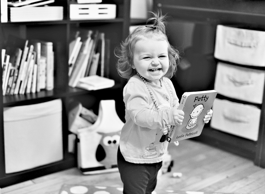 girl laughing with potty book