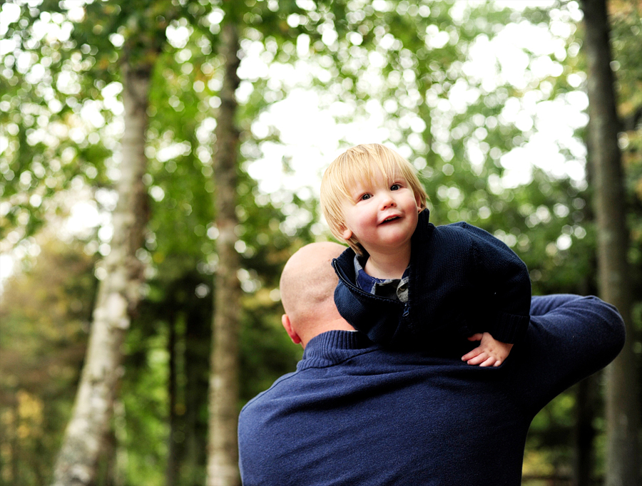 boy riding on his dad's back