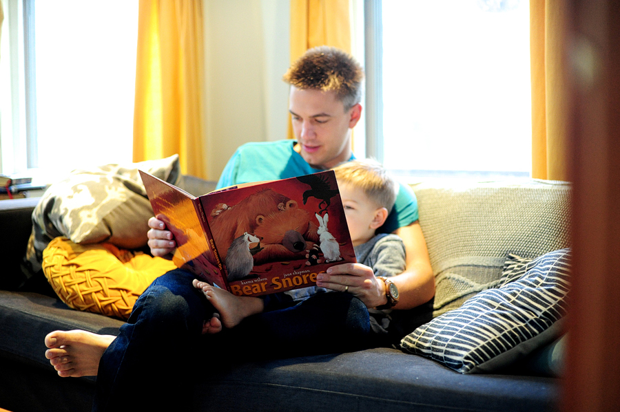 father reading bear snores to his son