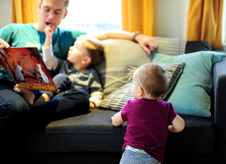 family cuddling on the couch