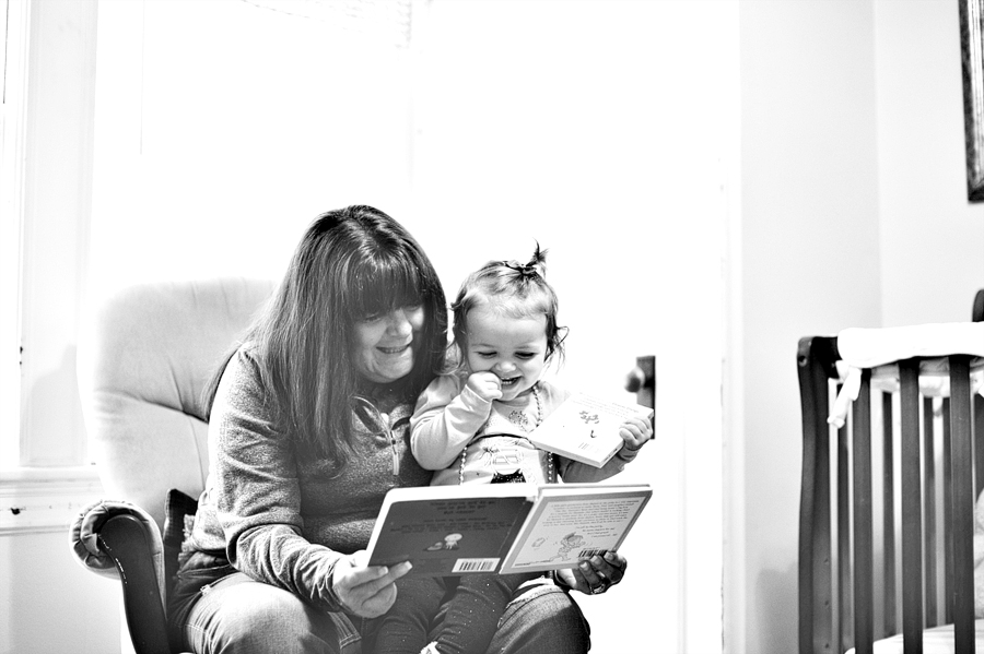 grandmother reading to her granddaughter