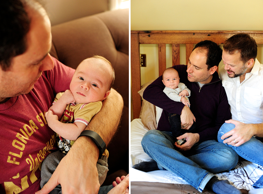 couple holding baby in bed