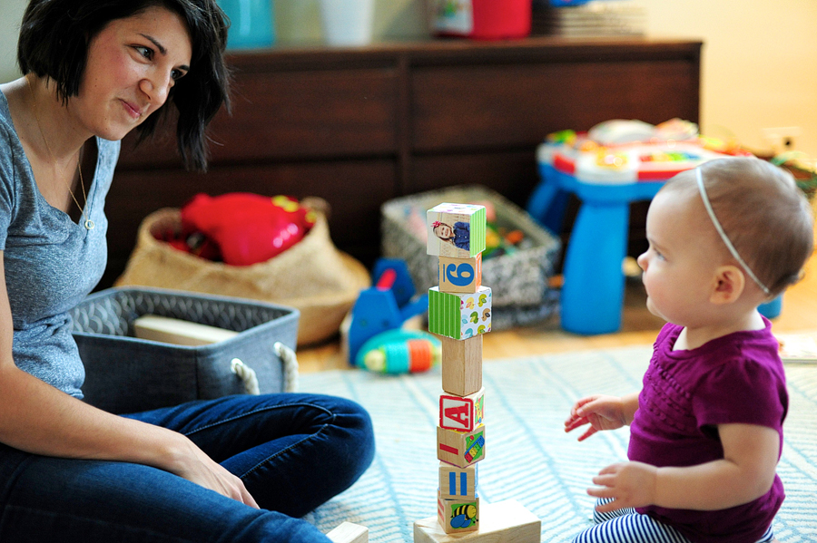 mother and daughter playing with blocks