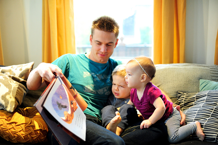 father reading to his children