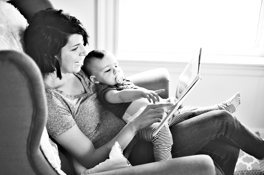 mother reading to baby daughter