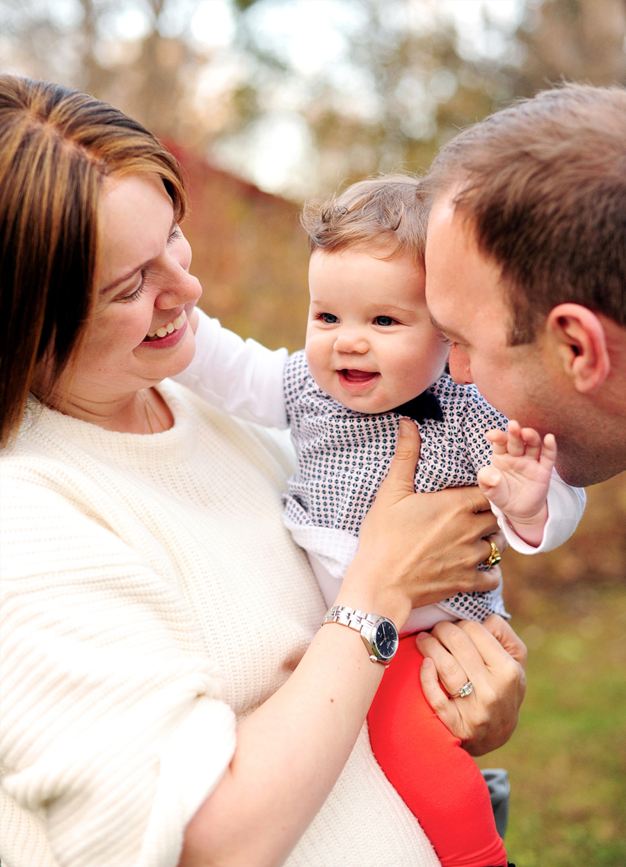 parents smiling at daughter