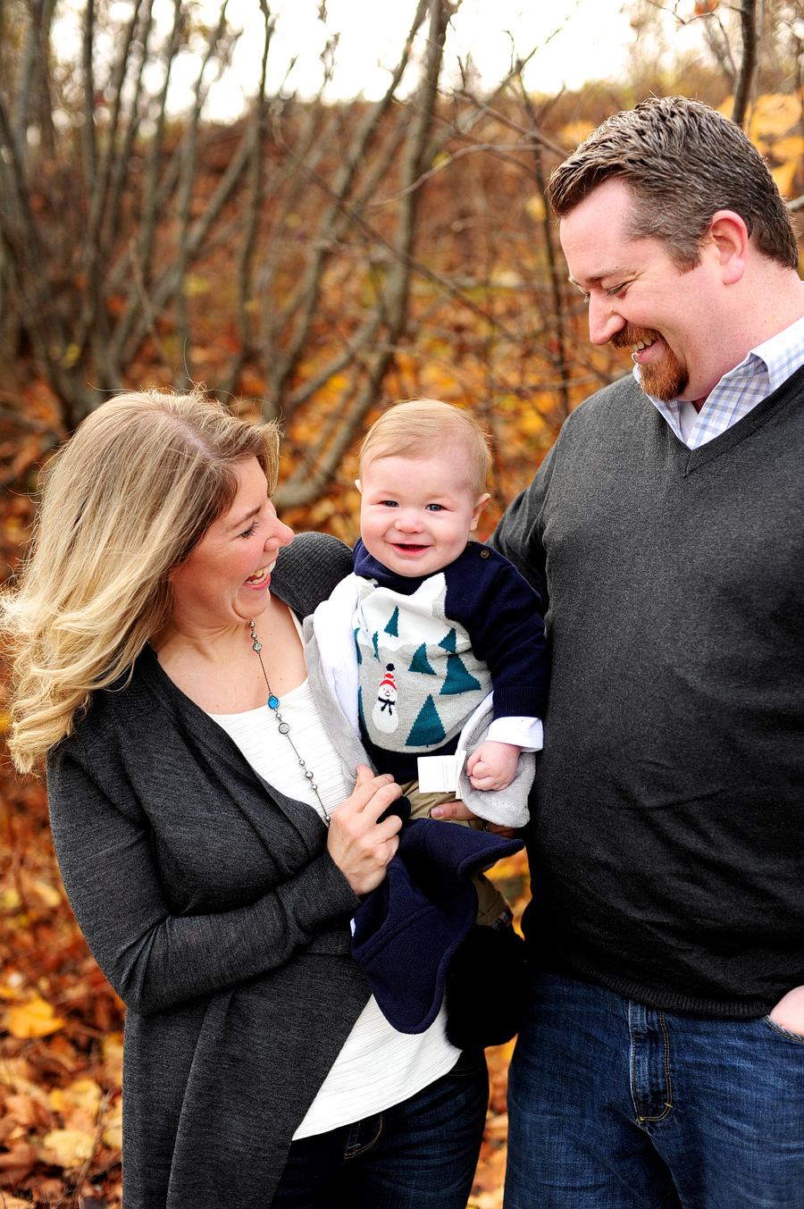 parents holding baby boy