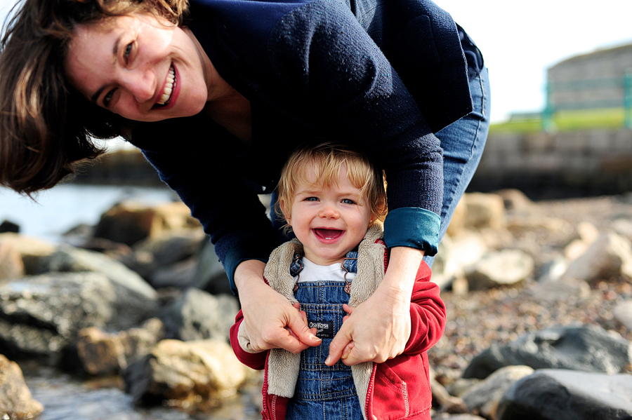 mom holding son's hands