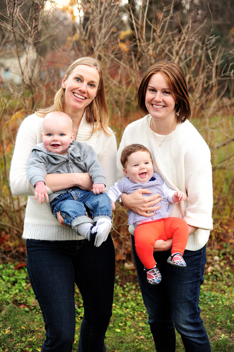 sisters holding babies